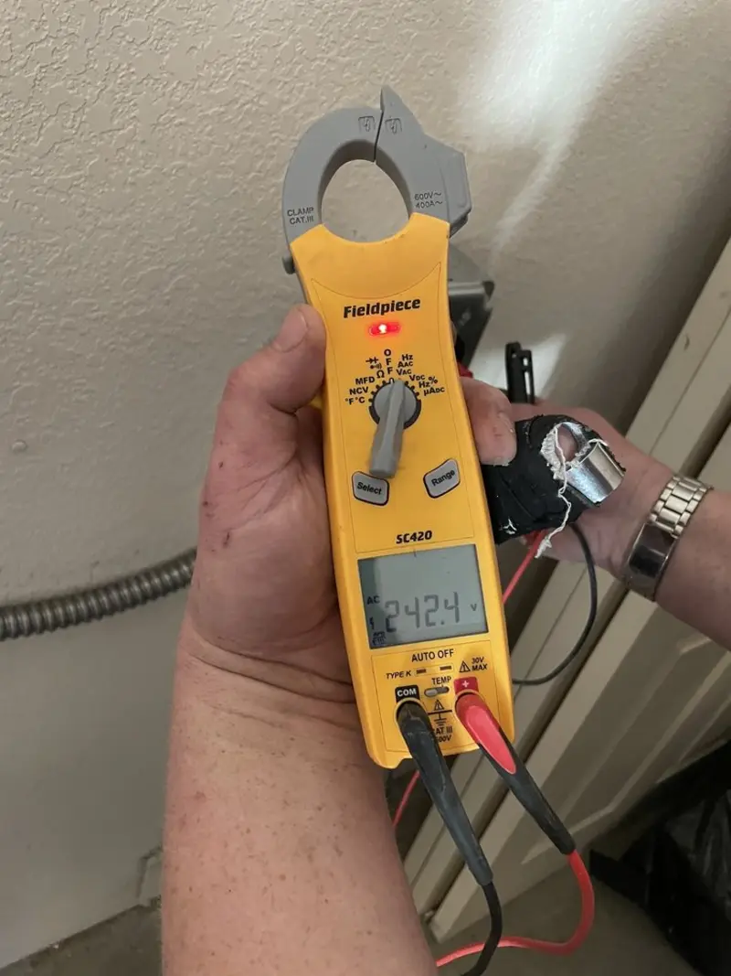 Voltage testing with clamp meter during Ceiling Fan Installation in DeForest